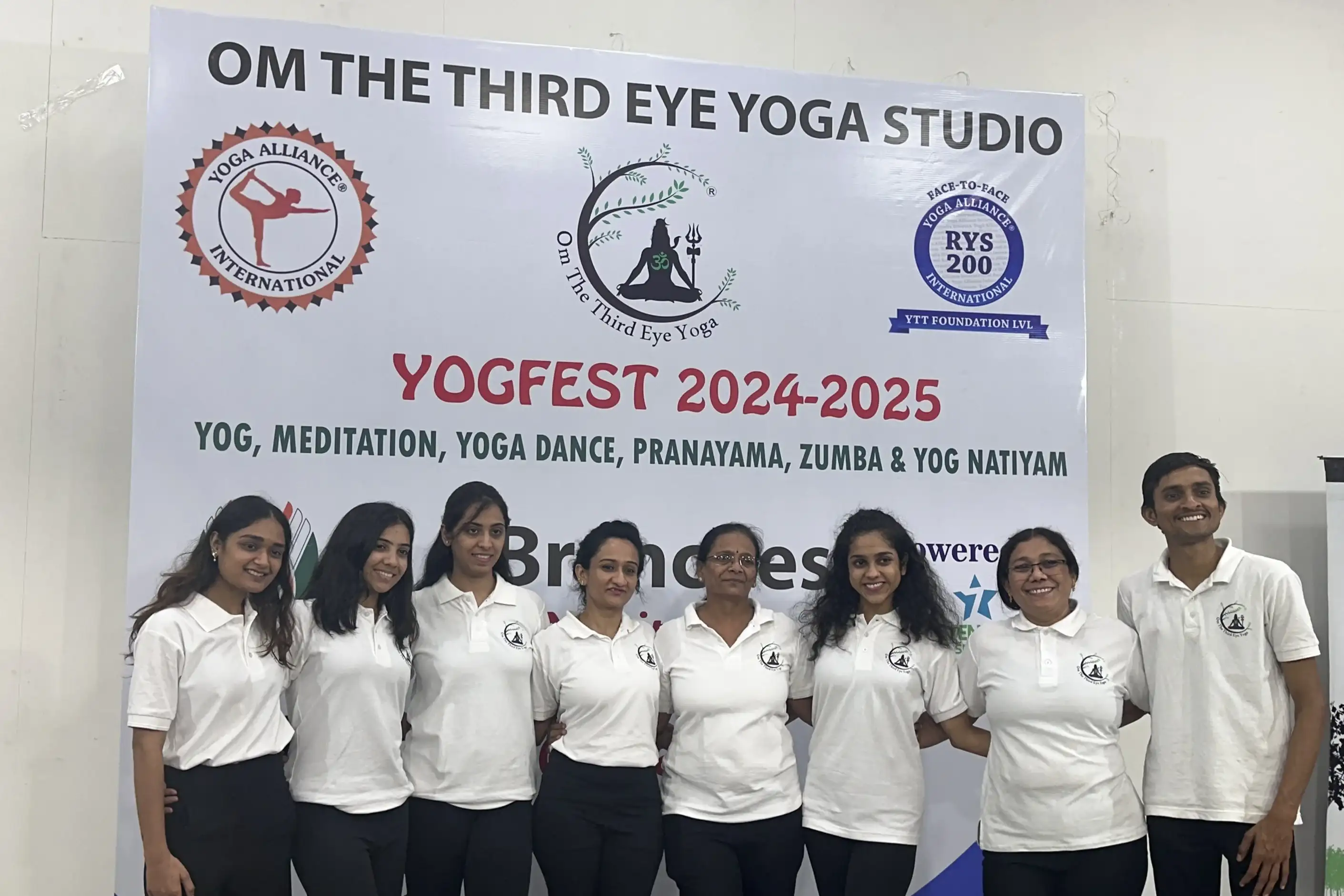 Students and instructors posing together after a successful wellness workshop.