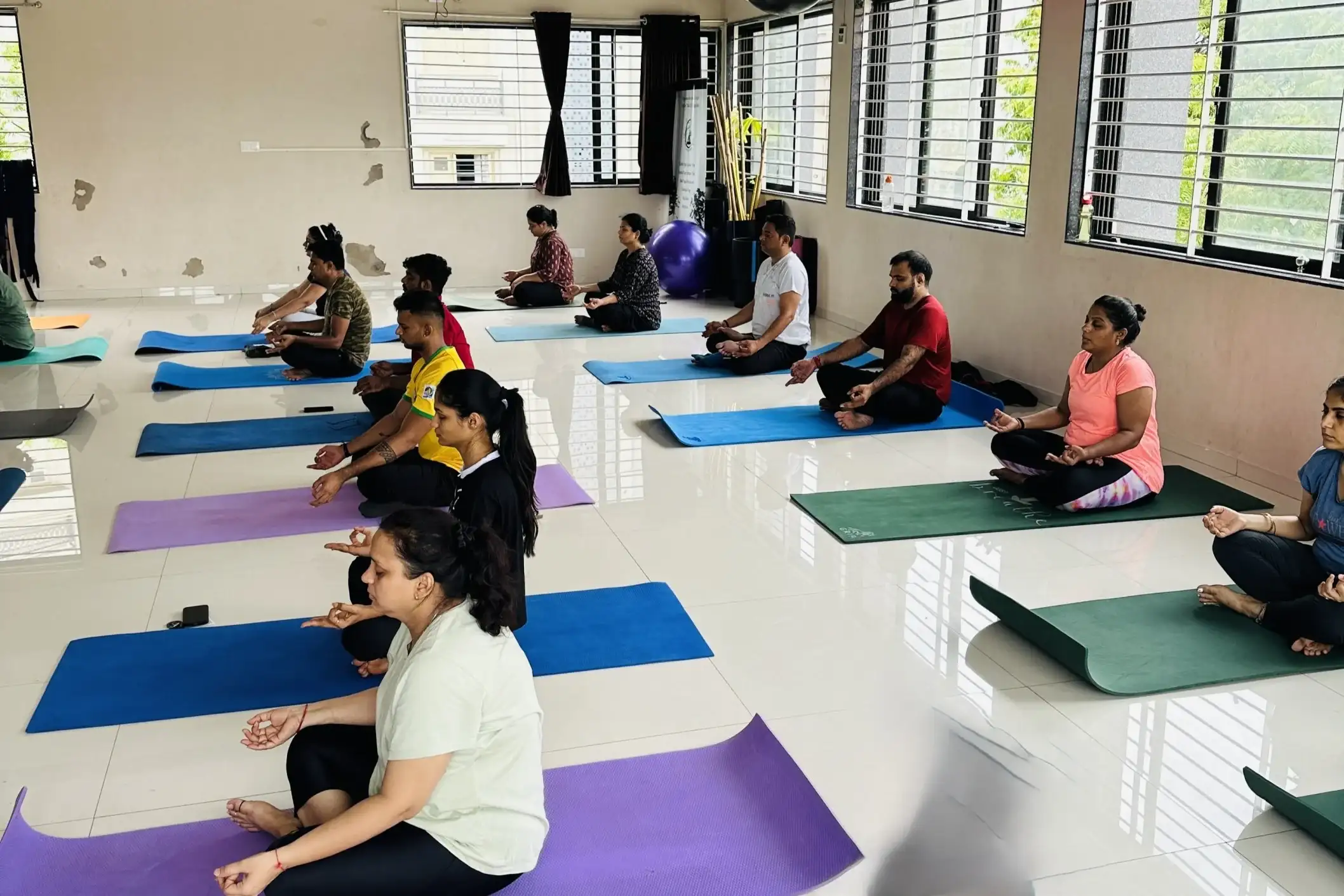 A morning yoga batch in Ahmedabad practicing mindful movements at dawn.