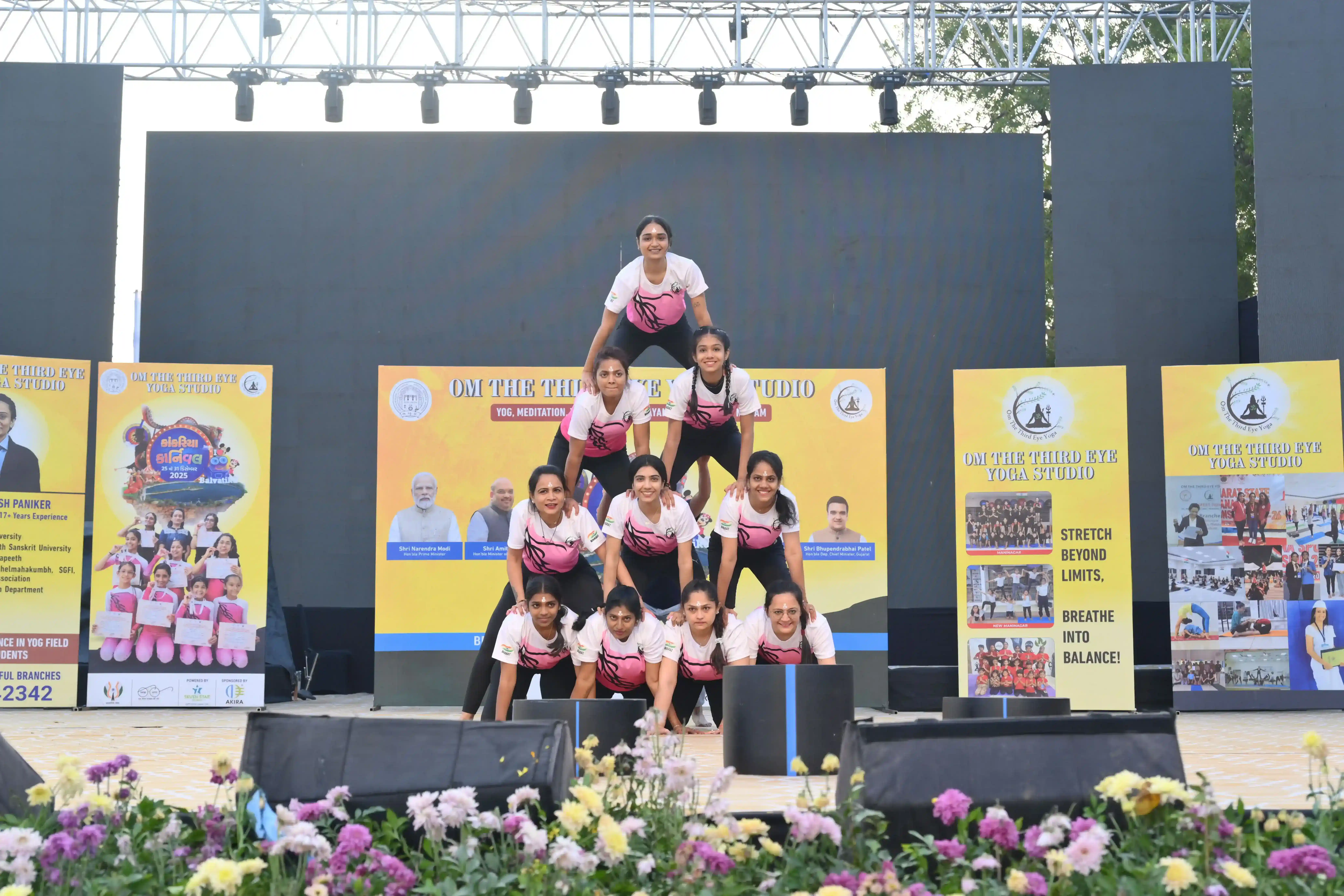 Women wellness group performing synchronized asanas for physical strength.