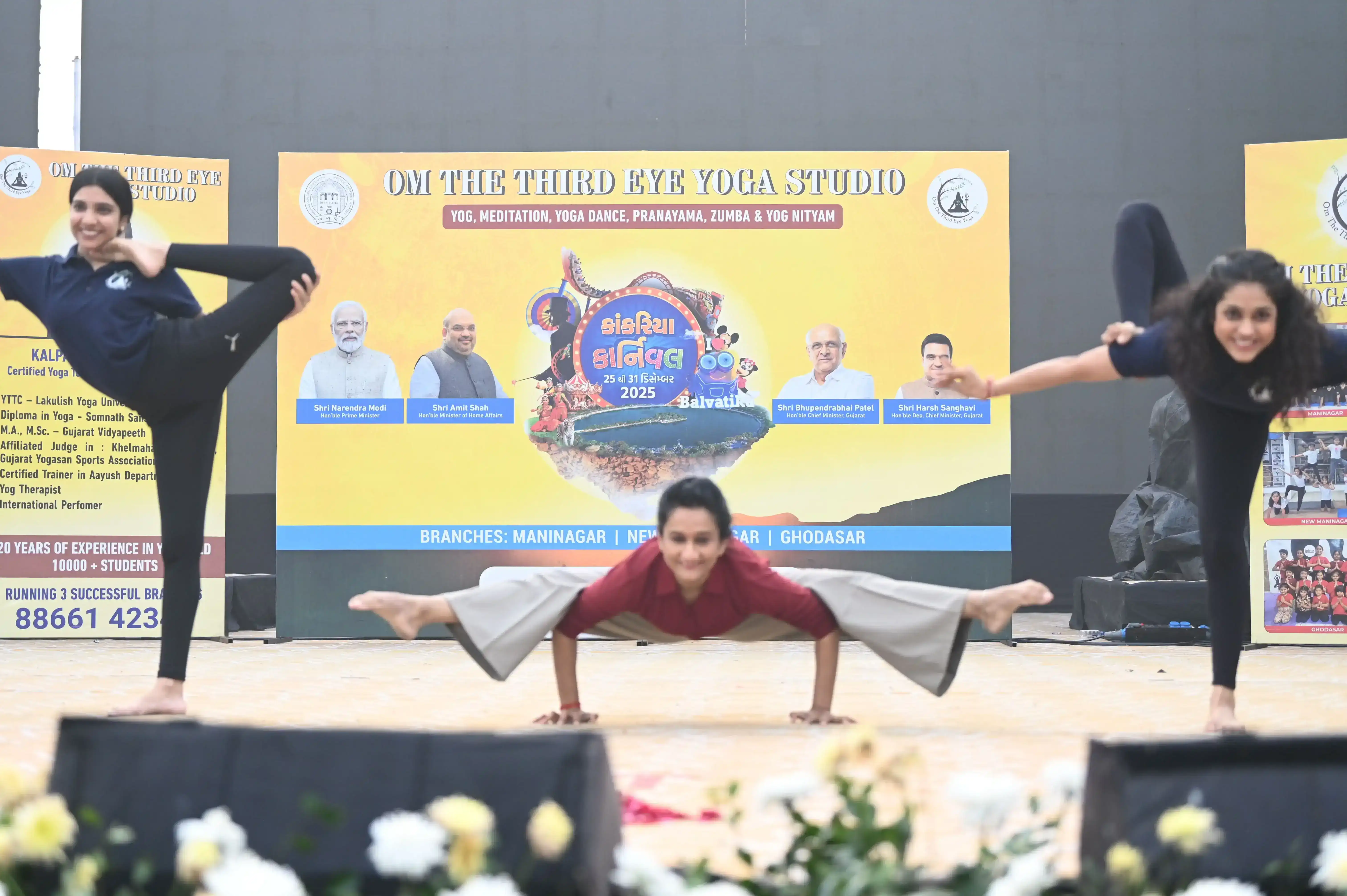 A professional stage demonstration of advanced yogic power and agility.