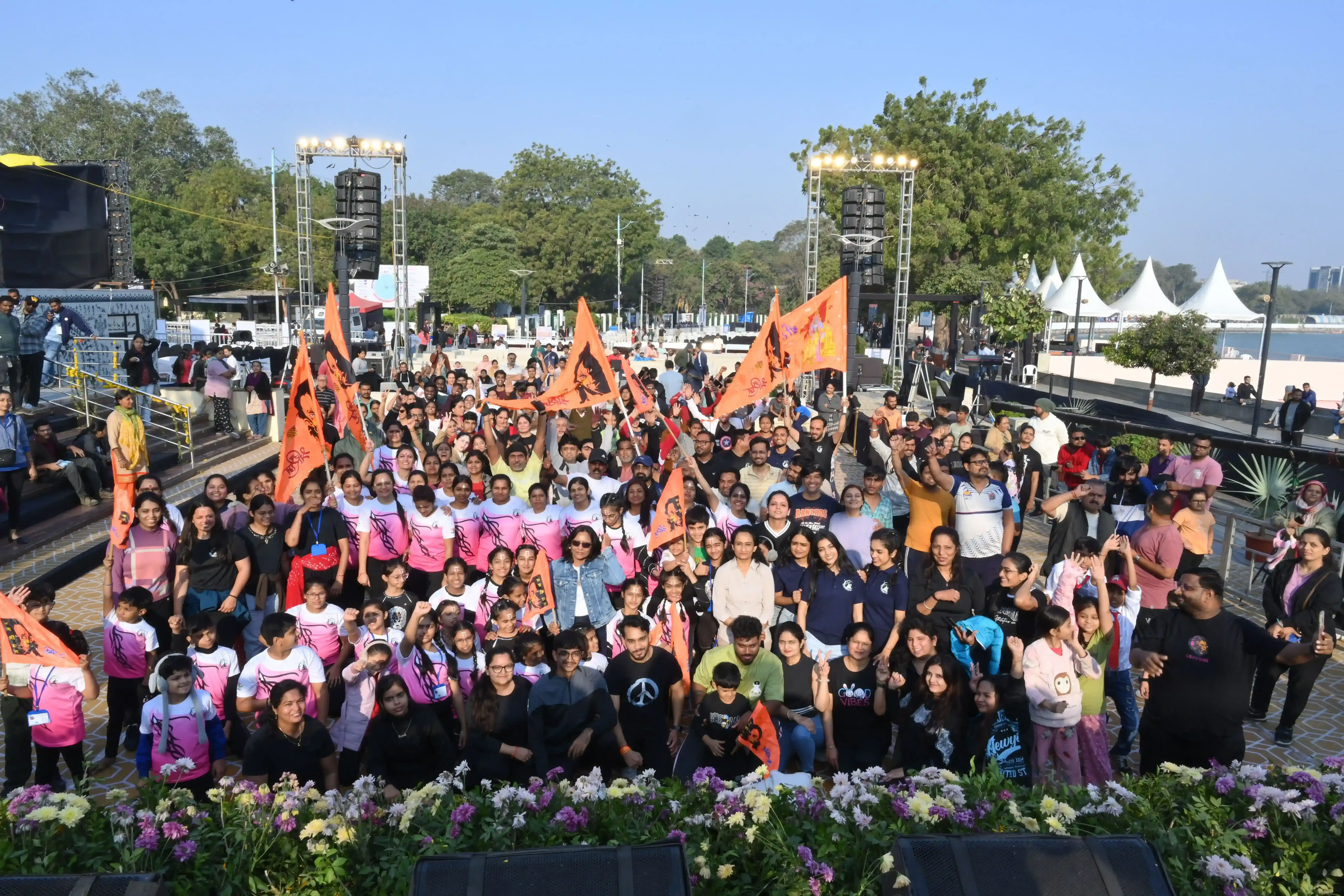 Our local community coming together for a large-scale outdoor yoga celebration.