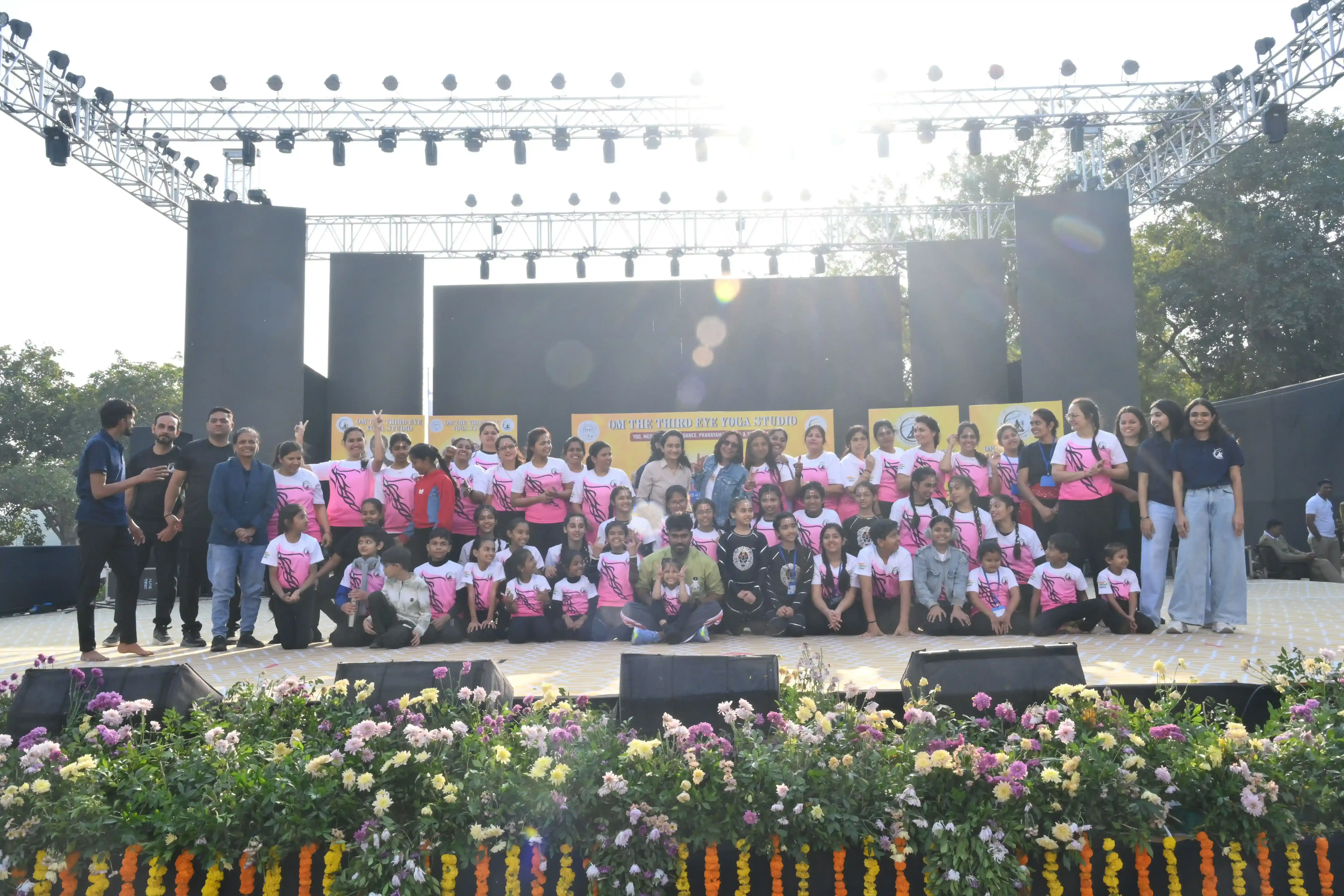A diverse group of students participating in a daily yoga session in New Maninagar.
